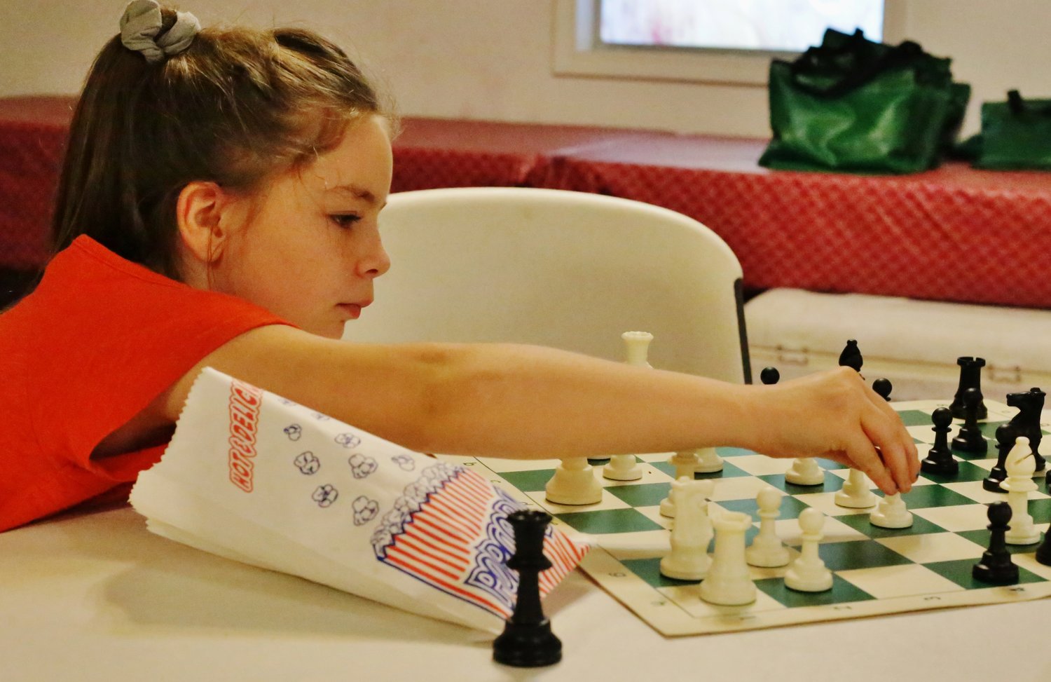 A young member of the Strobel family makes an early move in her first match of the evening.